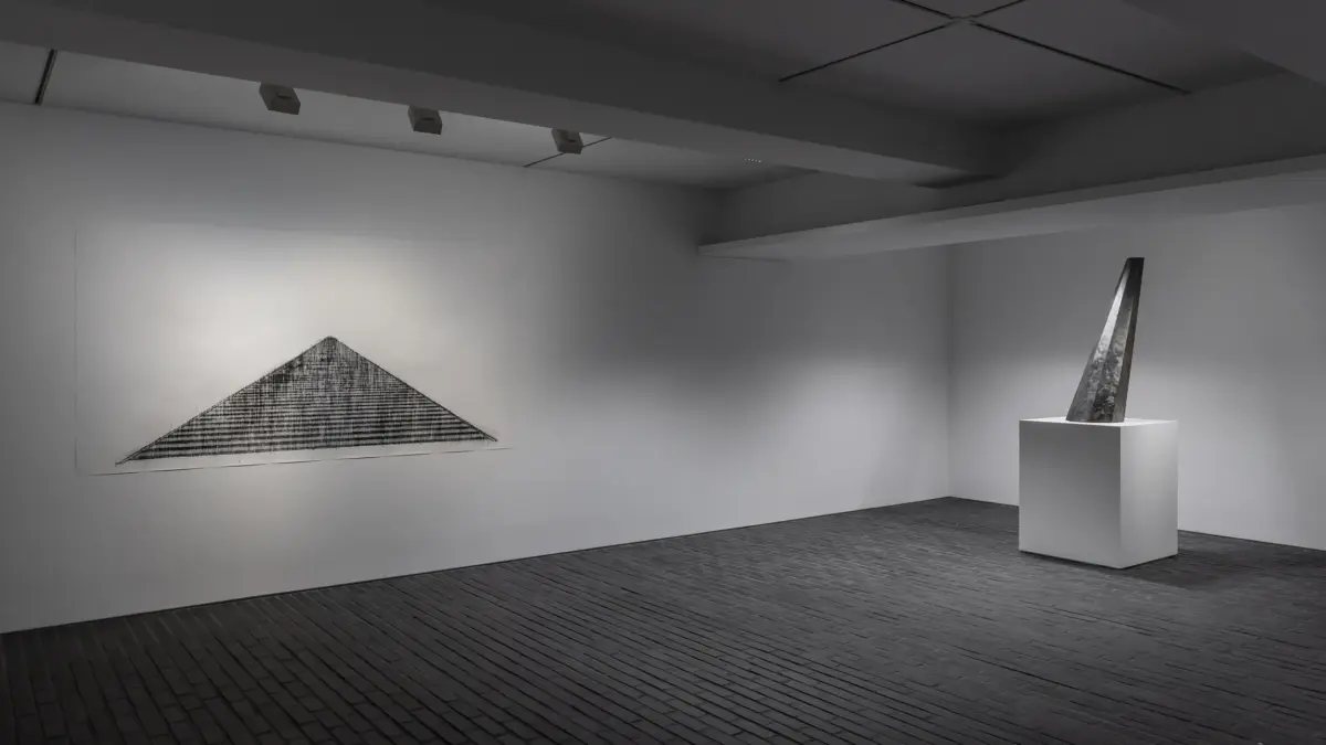 Installation view of basement floor at KIM Inbai A Man Asleep exhibition with triangular drawing and angled sculpture
