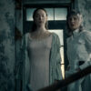 Two women in period dress in a decaying room in Monster: The Lizzie Borden Story