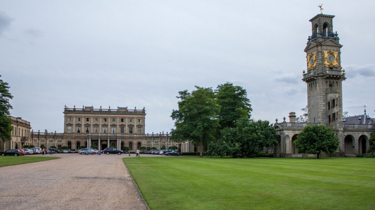 Cliveden House viewed from the formal parterre garden, with topiary and lawns in the foreground