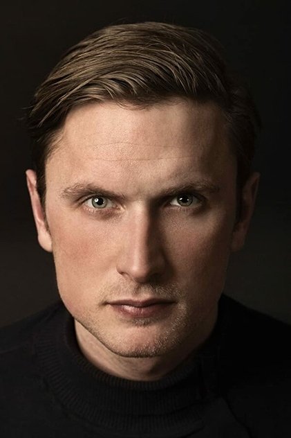 Mikkel Boe Følsgaard as Asger Holm Kirkegaard