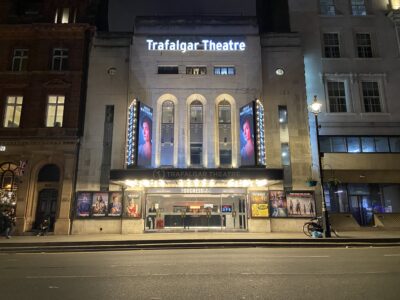 Trafalgar Theatre illuminated at night, London West End