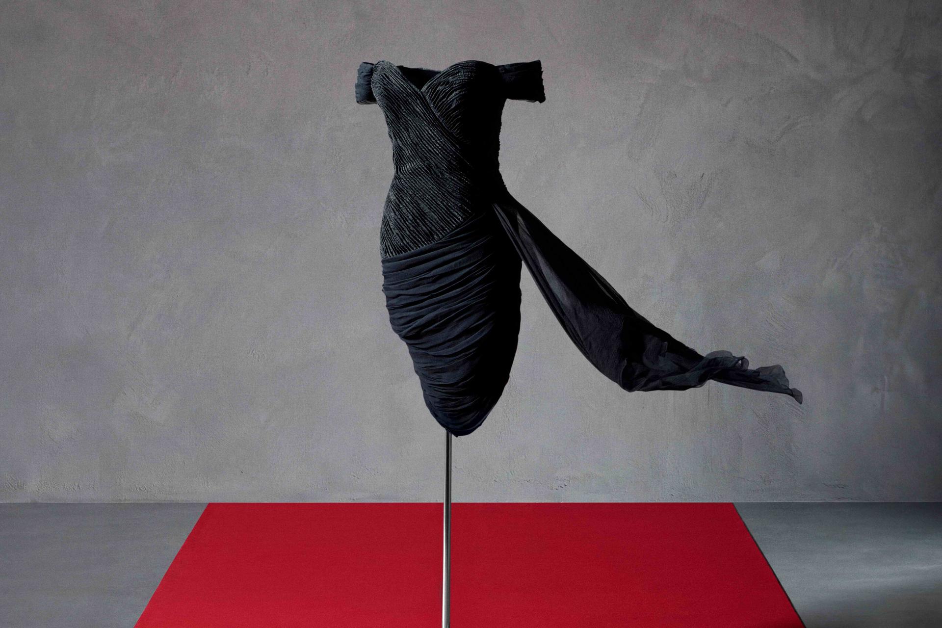 The black silk Revenge Dress by Christina Stambolian worn by Princess Diana, on display at Sotheby's