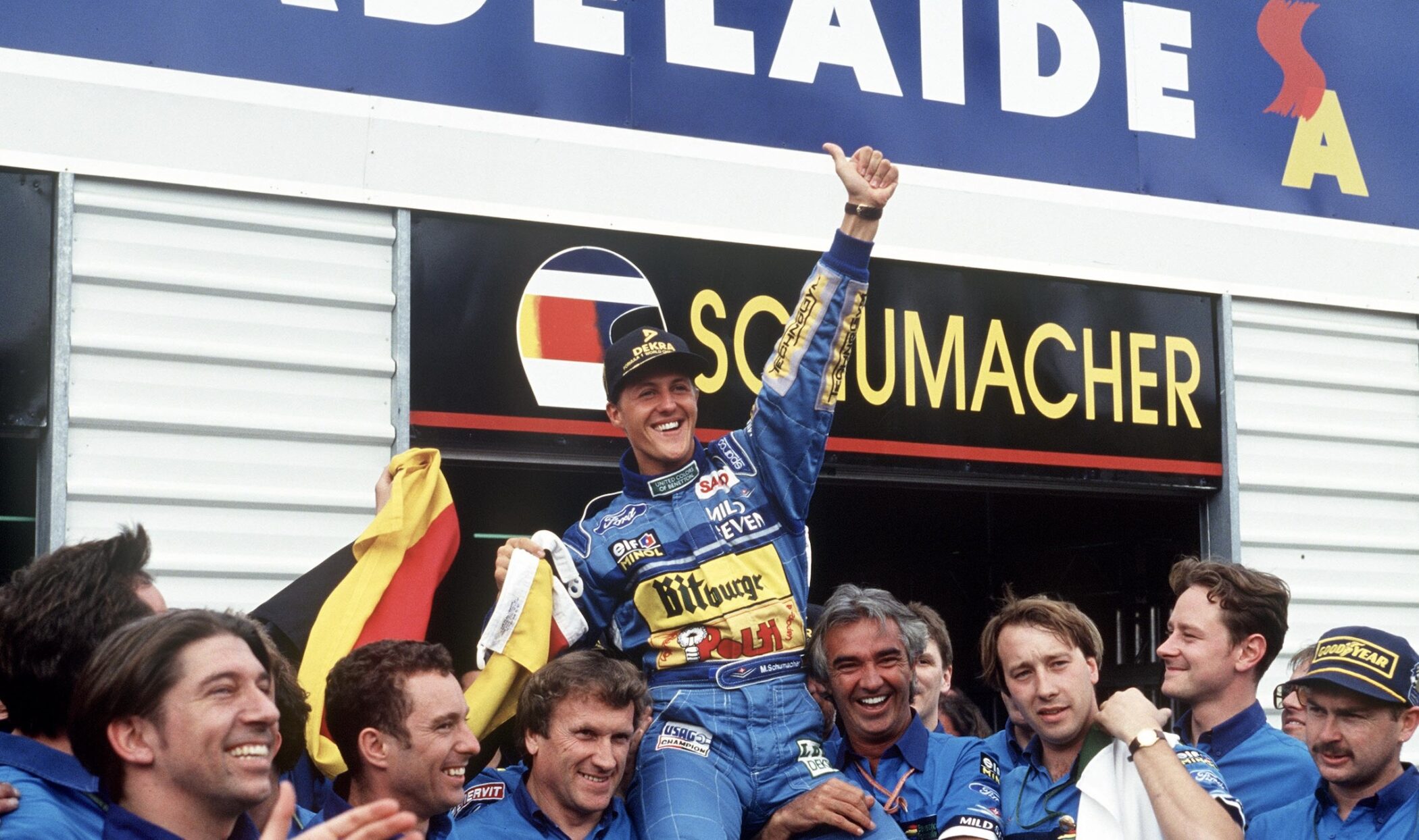 Michael Schumacher carried by Benetton team members in Adelaide after winning the 1994 title