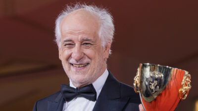 Italian actor Toni Servillo with the Coppa Volpi at the 82nd Venice Film Festival