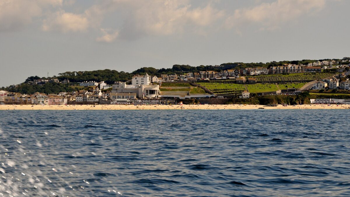 Tate St Ives above Porthmeor Beach seen across the Atlantic swell