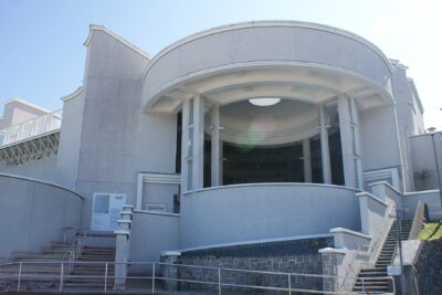 The white rotunda entrance of Tate St Ives in Cornwall under a clear sky