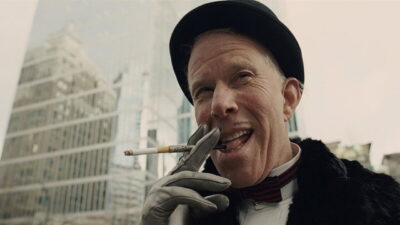 Tom Waits as Mr Nick, in a bowler hat with a cigarette, in The Imaginarium of Doctor Parnassus