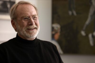 Martin Mull smiling during an interview in the Netflix documentary Who Is Martin Mull?