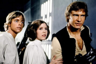 Mark Hamill, Carrie Fisher and Harrison Ford as Luke Skywalker, Princess Leia and Han Solo in Star Wars (1977)