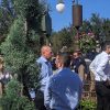 Bob Chapek, left, in a light blue shirt and Josh D’Amaro, right, in a white shirt, at Magic Kingdom with Cinderella Castle behind them