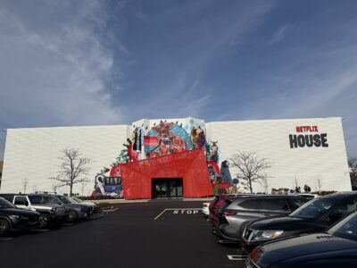 Exterior of Netflix House at King of Prussia Mall, Pennsylvania, with a mural of Netflix characters above a red entrance