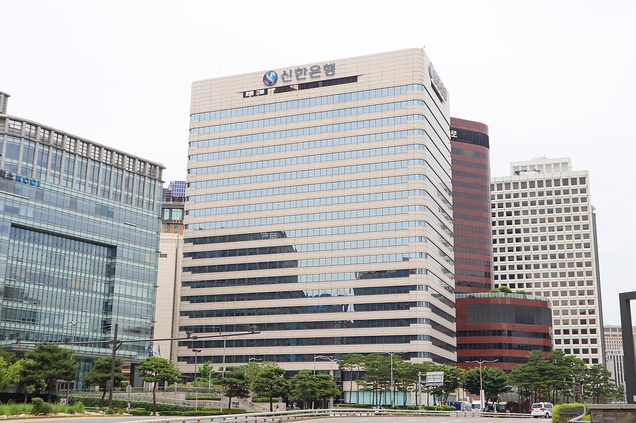 The Shinhan Bank tower in central Seoul with the bank logo and Korean name on its facade