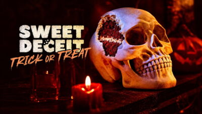 Sweet Deceit: Trick or Treat key art showing a skull-shaped cake cut open to reveal red velvet sponge, beside a lit red candle and a jack-o'-lantern