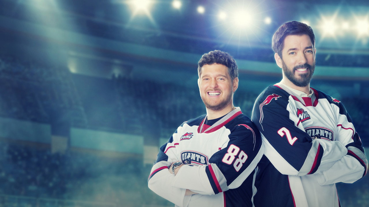 Michael Bublé and Drew Scott in Vancouver Giants jerseys, arms crossed, in a hockey arena for Hometown Giants on Prime Video