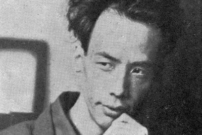 Ryūnosuke Akutagawa, black-and-white portrait, chin resting on his hand, 1927