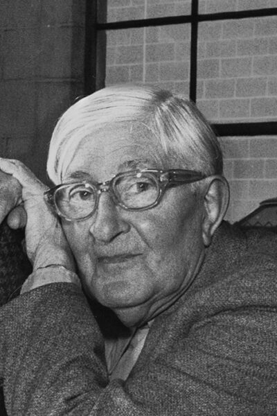 Black-and-white photograph of an elderly Josef Albers in thick-framed glasses, resting his head on his hand, 1972
