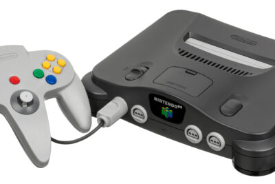 A Nintendo 64 console with its grey controller plugged in