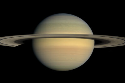 Saturn and its rings seen almost edge-on against black space in a natural-colour mosaic from the Cassini spacecraft