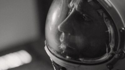 Guy Kent in an astronaut helmet as Commander Freddie Ballard in the sci-fi short AURORA