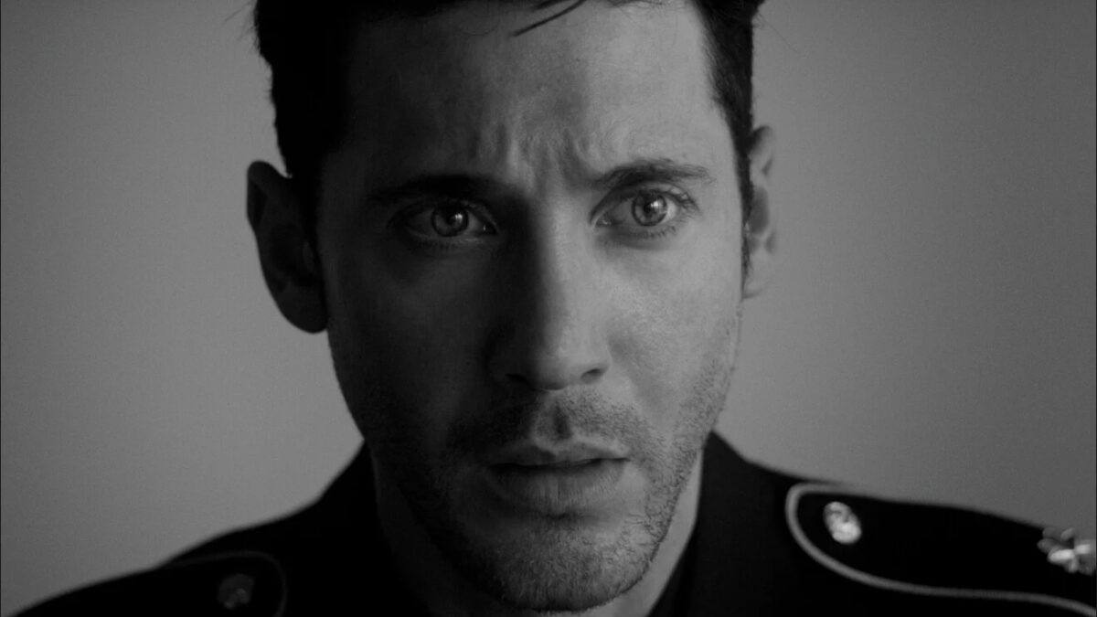 Guy Kent as Commander Freddie Ballard in a black-and-white close-up from AURORA