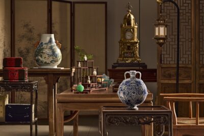 Qianlong yangcai Hundred Deer hu-form vase, an emerald-green jadeite snuff bottle and a blue-and-white flask staged in a Chinese scholar’s interior