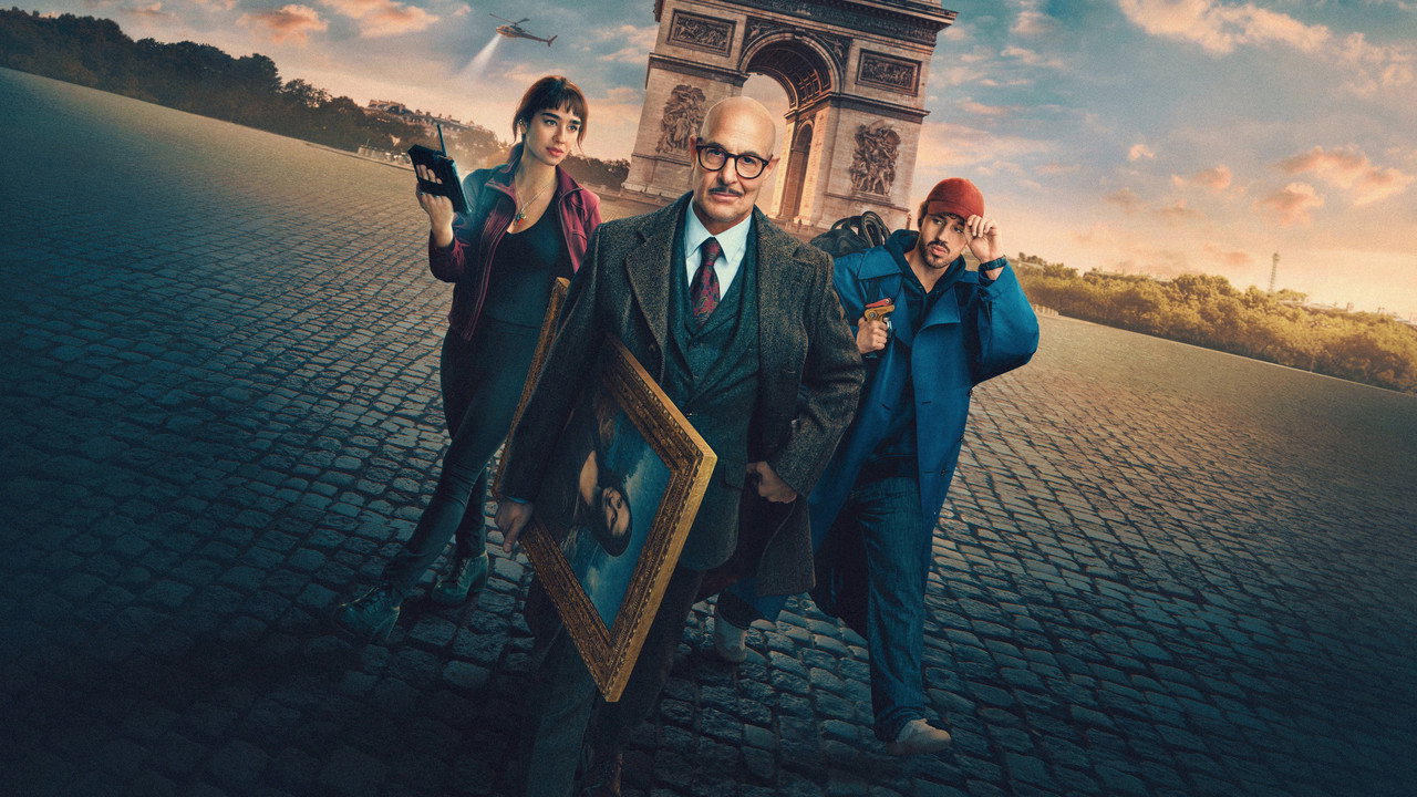 Stanley Tucci carrying a framed Mona Lisa beside Simona Tabasco and Victor Belmondo on a cobbled Paris square, Arc de Triomphe behind, in Masterplan key art