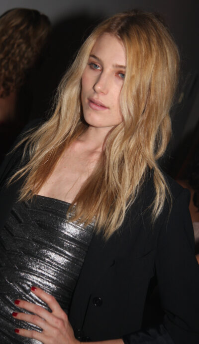 Dree Hemingway with long blonde hair, black jacket and metallic dress, photographed in June 2009