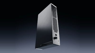 Ghost Core screenless desktop computer for personal AI agents, brushed steel tower with rear vents and power connector