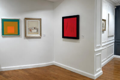 A Morandi still life hung between an Albers Homage to the Square and a red Fontana cut canvas