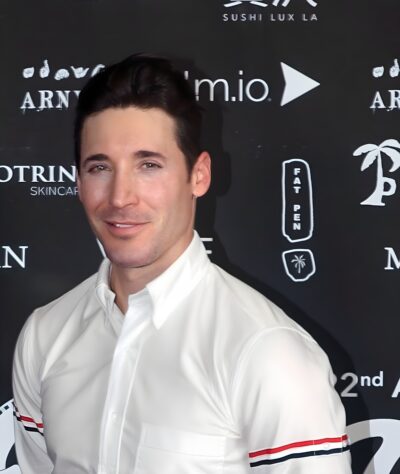 Guy Kent in a white shirt on the red carpet of the HollyShorts Film Festival in Los Angeles, 2026
