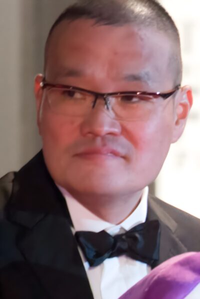 Hideo Nakata in a black tuxedo and glasses at the opening ceremony of the 28th Tokyo International Film Festival, 2015