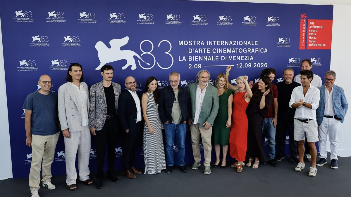 The Holy Wood Dust film delegation at the Venice Film Festival photocall in front of the festival backdrop