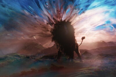 Aslan the lion against a burst of light in Greta Gerwig’s Narnia: The Magician’s Nephew