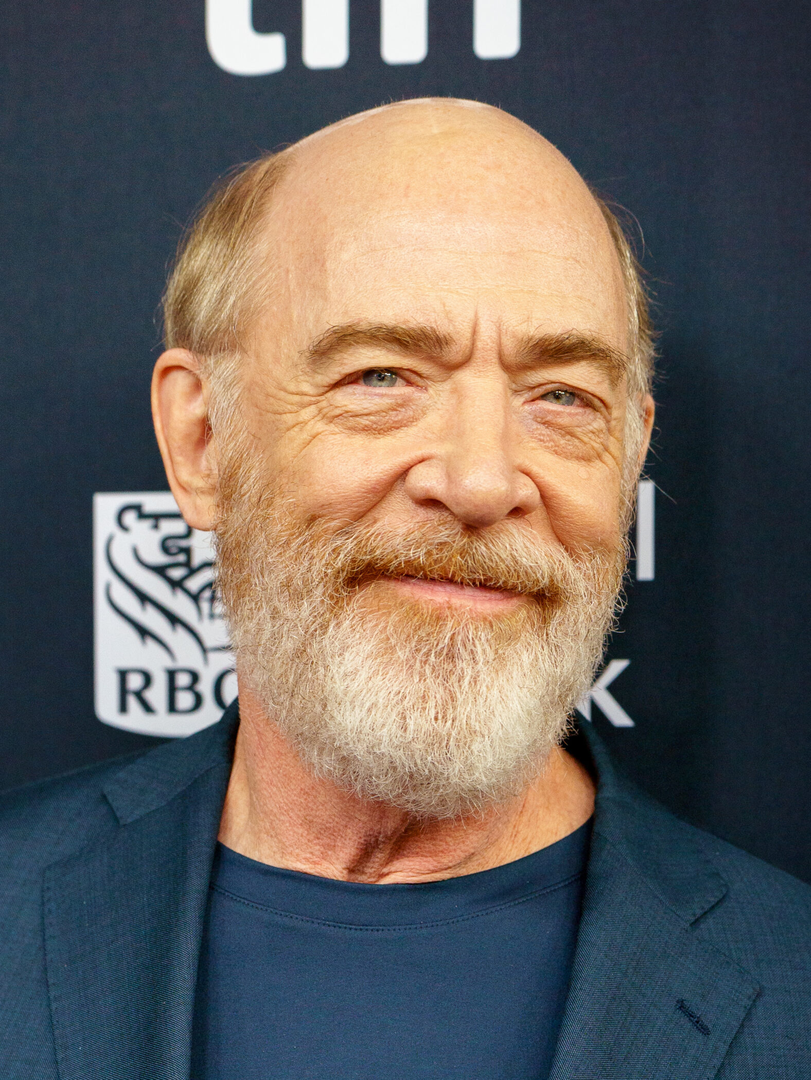 J.K. Simmons smiling on the red carpet at the 2024 Toronto International Film Festival, where he presented Saturday Night