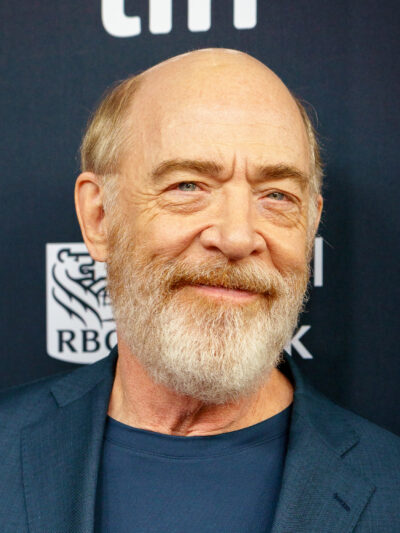 J.K. Simmons smiling on the red carpet at the 2024 Toronto International Film Festival, where he presented Saturday Night