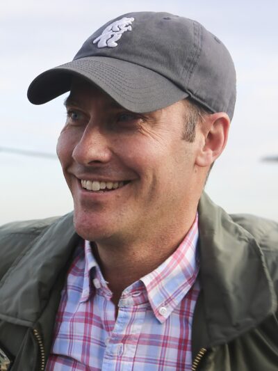 Jeremy Garelick in a grey baseball cap and flight jacket at Marine Corps Air Station Miramar, January 2015