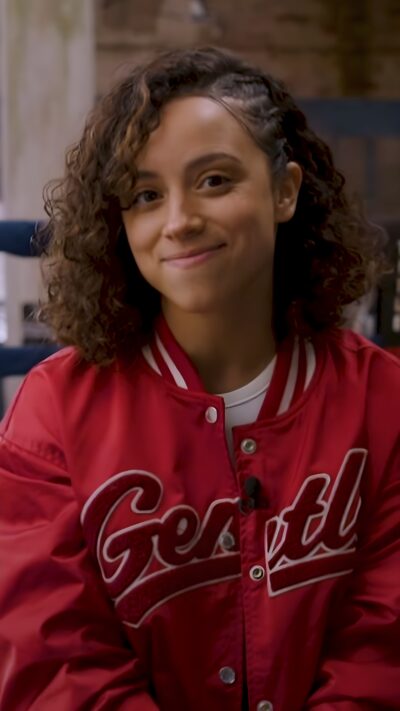 Kiana Madeira in a red varsity jacket during a 2023 interview promoting Perfect Addiction