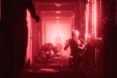 Mannequin figures crouch in a blood-red corridor aboard the ocean liner in Layers of Fear