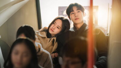 Kim So-hyun rests her head on Choo Young-woo's shoulder on a city bus in a still from the Korean series Between Steps