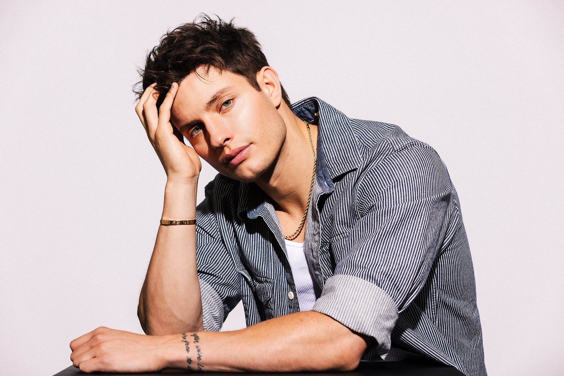 Matt Rife in a studio portrait wearing a striped denim shirt, September 2025