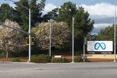 The Meta sign at 1 Hacker Way, the entrance to Meta's headquarters in Menlo Park, California