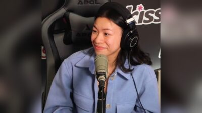 Nathania Ong in headphones at a microphone during a Kiss92 radio interview in Singapore, 2023