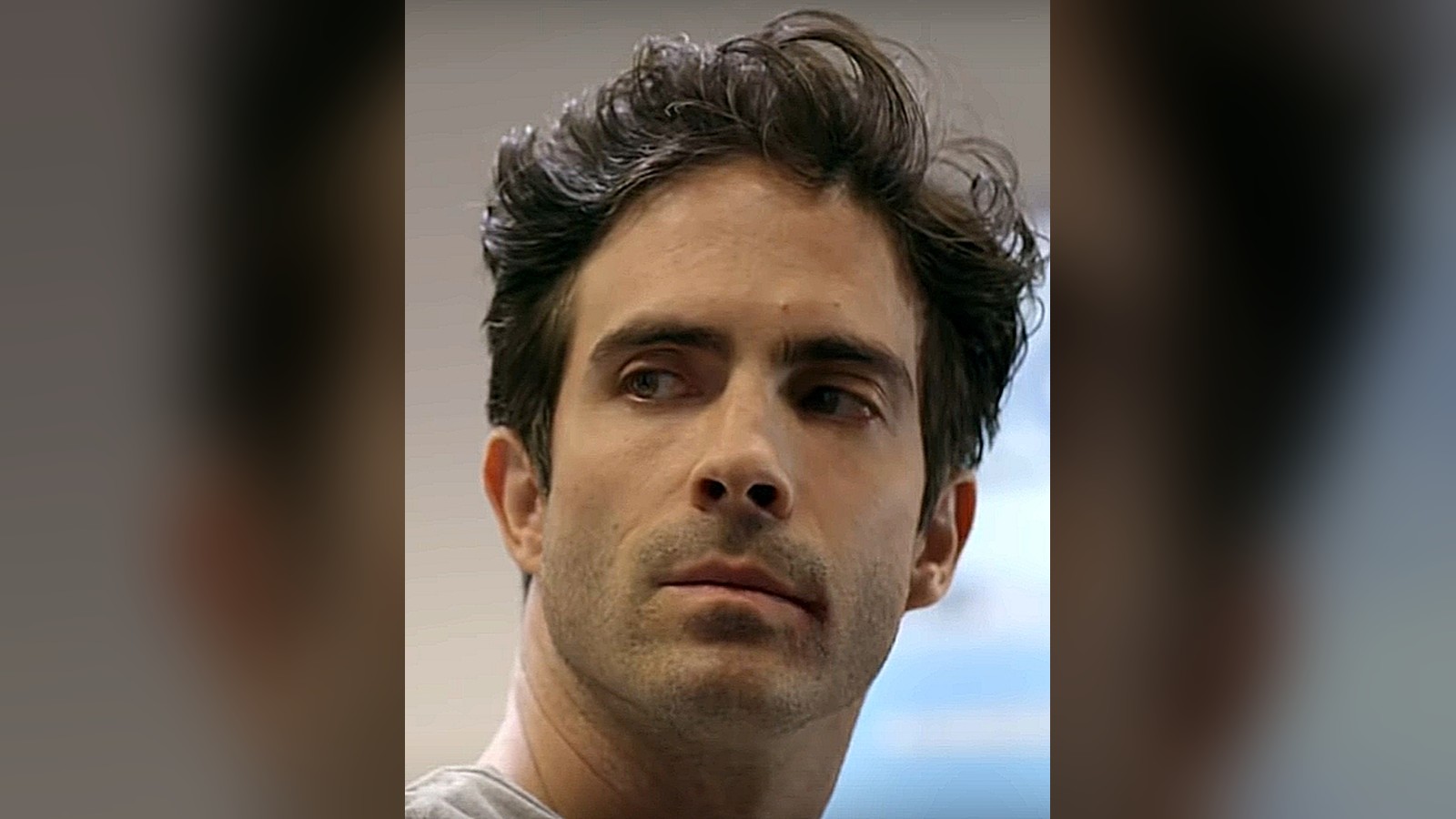 Osvaldo Benavides in a 2018 close-up, dark tousled hair, looking off camera