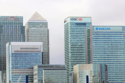 Office towers in London's Canary Wharf, with the Barclays headquarters tower and its logo on the right beside HSBC and Citi