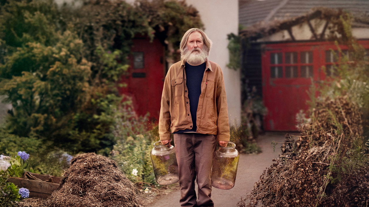 Pearce Quigley as Michael Sleep carries two empty glass jars past piles of manure in a suburban driveway in Small Prophets