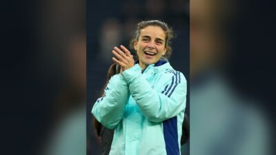Renée Slegers, Arsenal head coach, applauding the fans after a Women's Super League match in November 2024