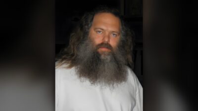 Rick Rubin, record producer, with long grey beard and white shirt in 2006