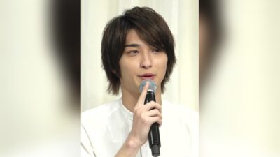Ryusei Yokohama speaking into a microphone at a Shiseido brand event in Tokyo, 2019