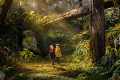 Prue and Curtis walk a sunlit forest path in Wildwood, the Laika stop-motion film directed by Travis Knight