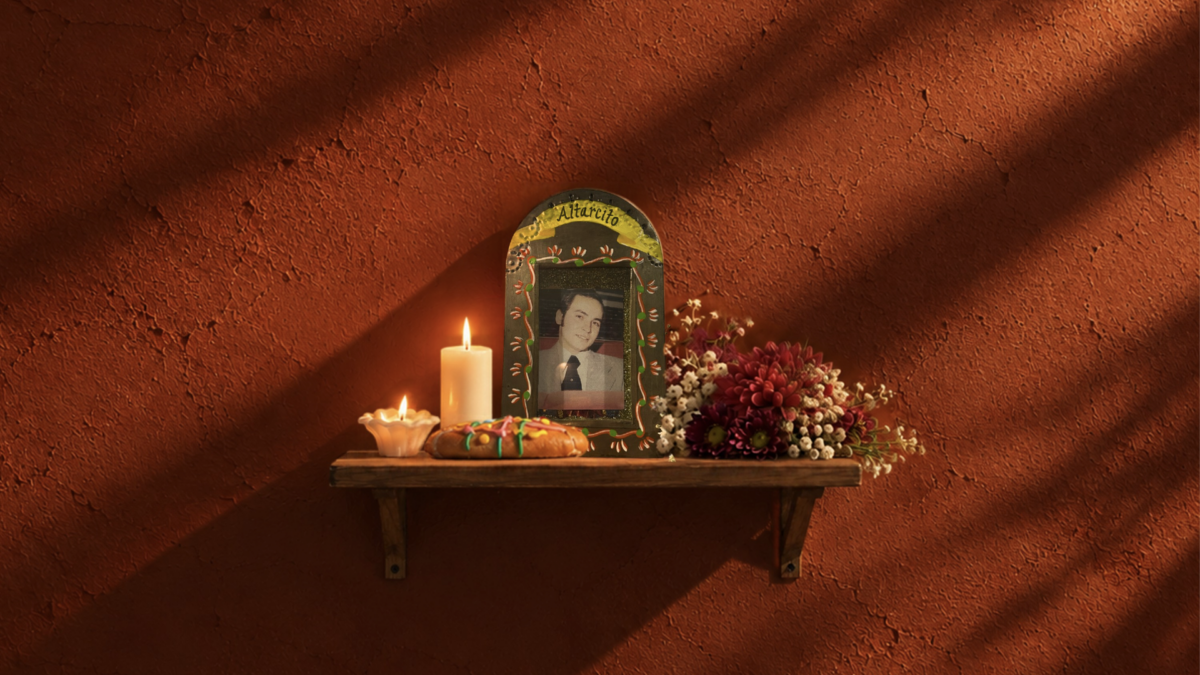 Altarcito single cover: a small home altar with candles, bread, flowers and a framed photo on a shelf